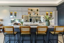 Shaker-style kitchen island and mirrored splashback